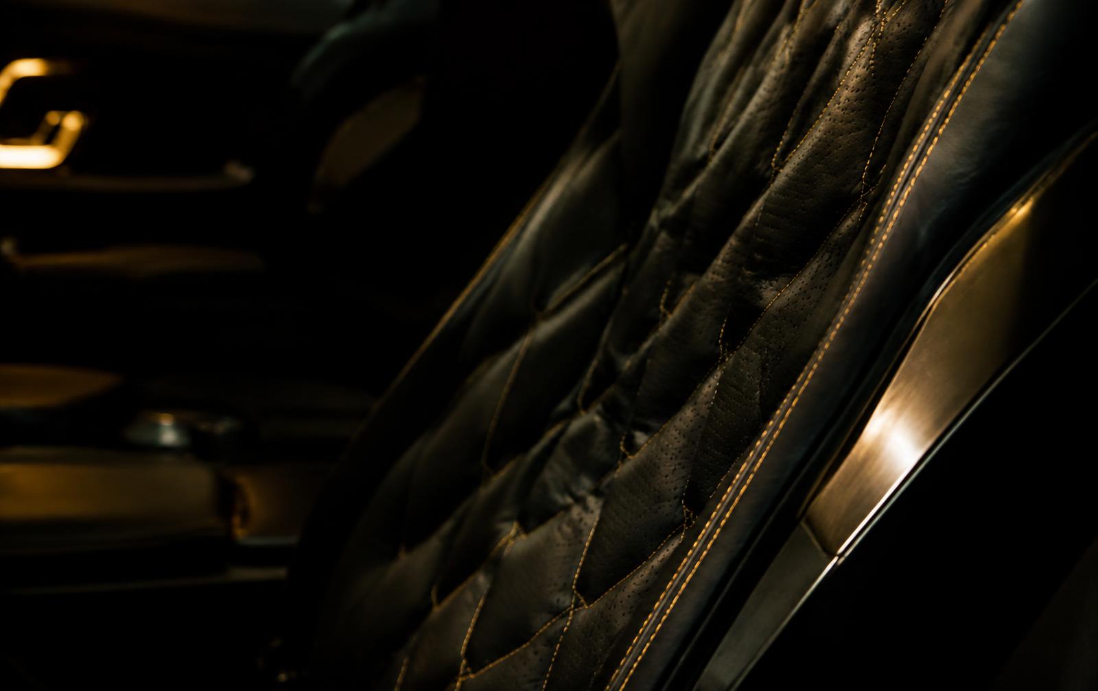 Quilted leather seat with gold stitching